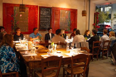 The covered terrace at Salumeria 104 Coral Gables set with long tables