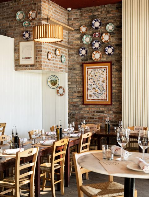 Open dining room and chalkboard menu at Salumeria 104 Midtown