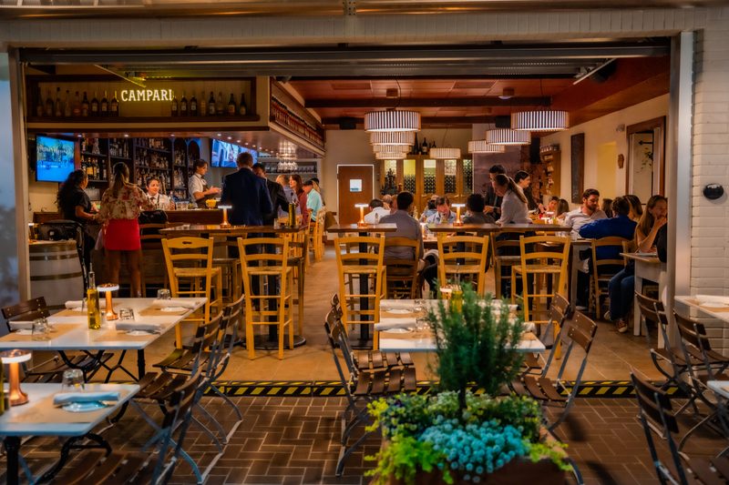 Wine and entree tableside at Salumeria 104 Atlantic Beach
